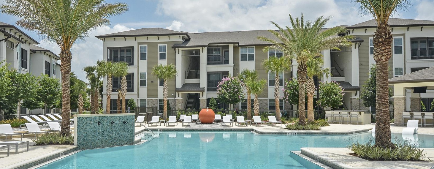 a pool in front of a building