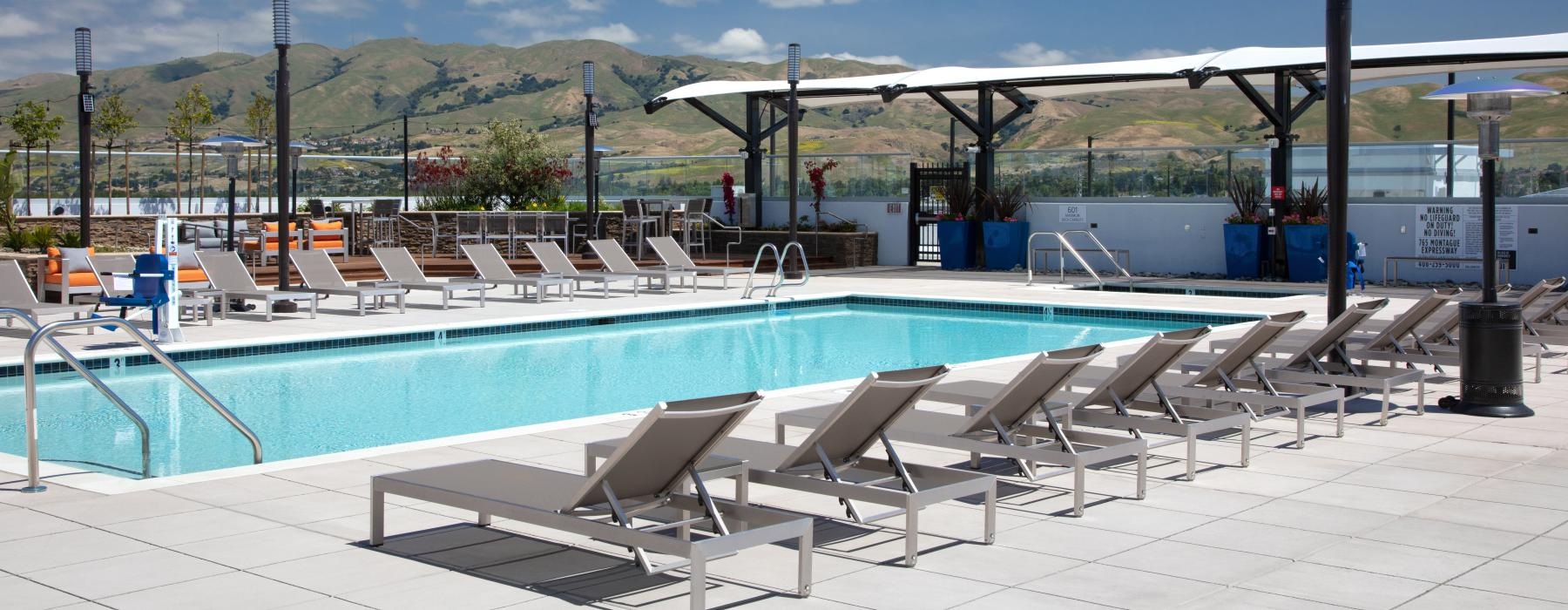 a pool with chairs around it