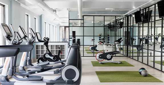 Fitness Center with cardio equipment at St. Marys Square Apartments, North Carolina, 27605