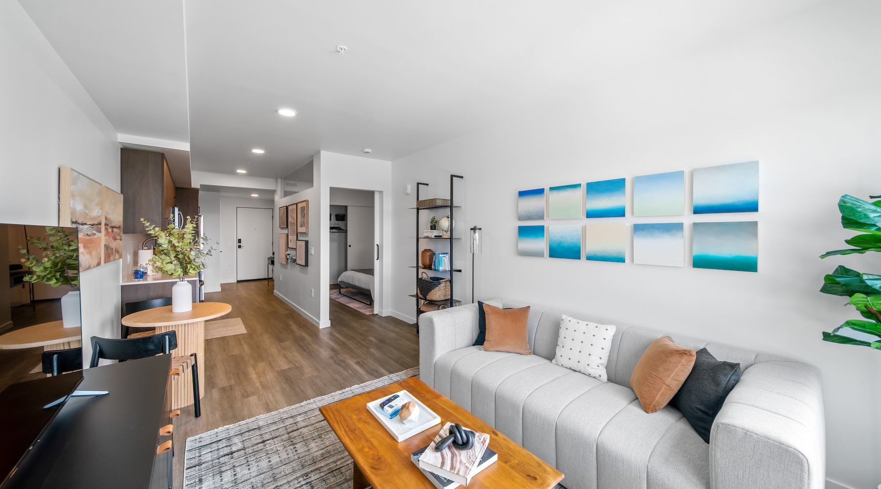 a living room with a couch, a tv and a coffee table