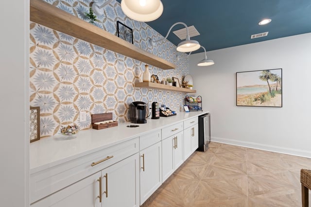 Coffee station with a Keurig coffee maker, tea, and snacks.