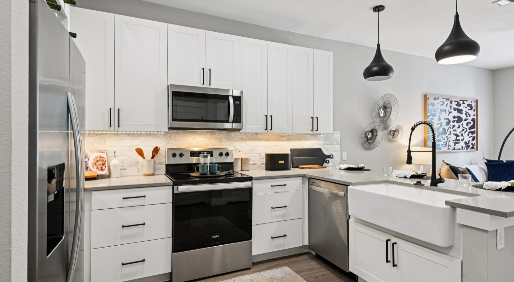 apartment kitchen with white cabinets