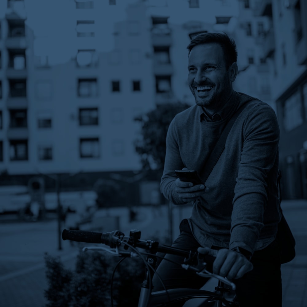 A man on his bicycle at Mission Rock Residential in Denver, Colorado