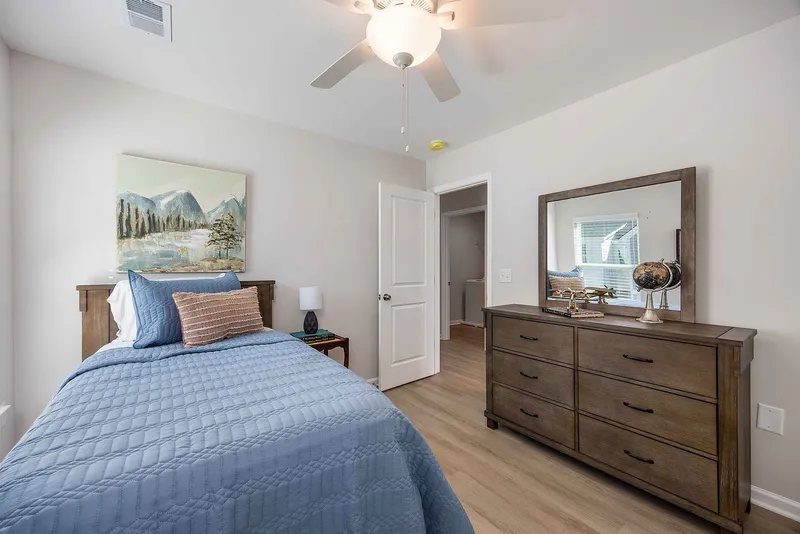 Guest bedroom with twin bed and dresser