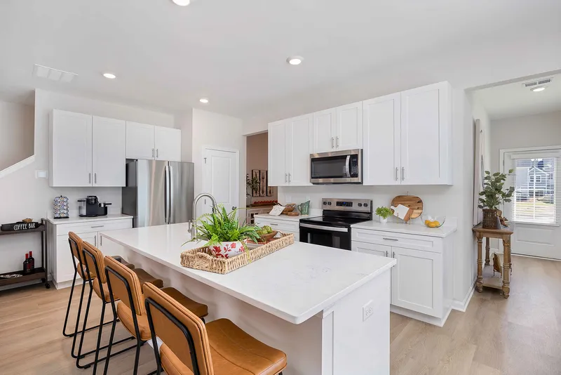 Kitchen with white cabinets and stainless steel appliances