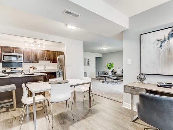 Den, Dining Room, and Kitchen at Kenilworth at Perring Park Apartments, Parkville, MD, 21234