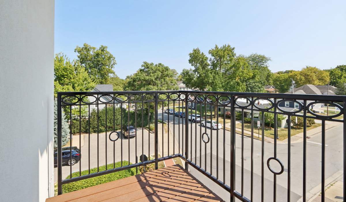 Patio with iron railing at The Apartments at 1st on Main in Carmel, Indiana