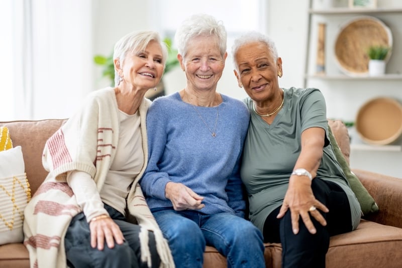 Happy women smiling on couch