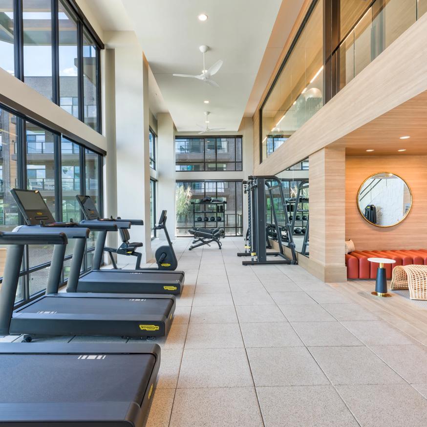 fitness center with large windows and treadmill modera reserve apartments scottsdale az