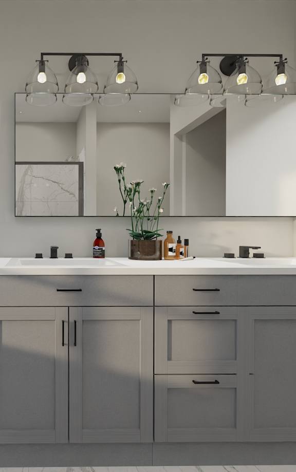 a bathroom with gray cabinets and a sink and a mirror