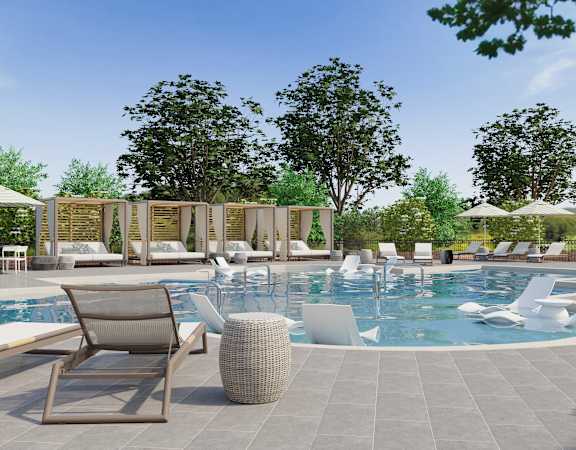 A large outdoor swimming pool surrounded by lounge chairs and umbrellas.