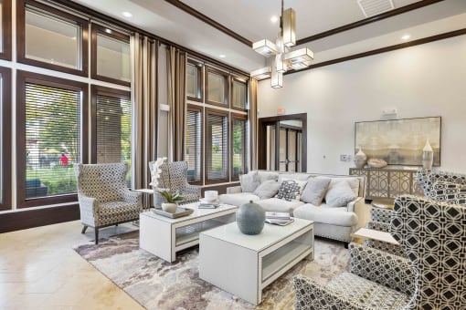 Elegant resident clubhouse at 33hundred Apartments Austin TX with stylish seating, high ceilings, and natural light for socializing or relaxing