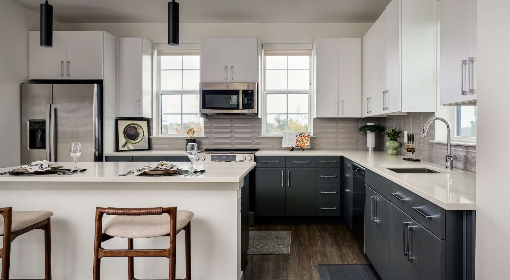 a kitchen with ample cabinets and stainless steel appliances