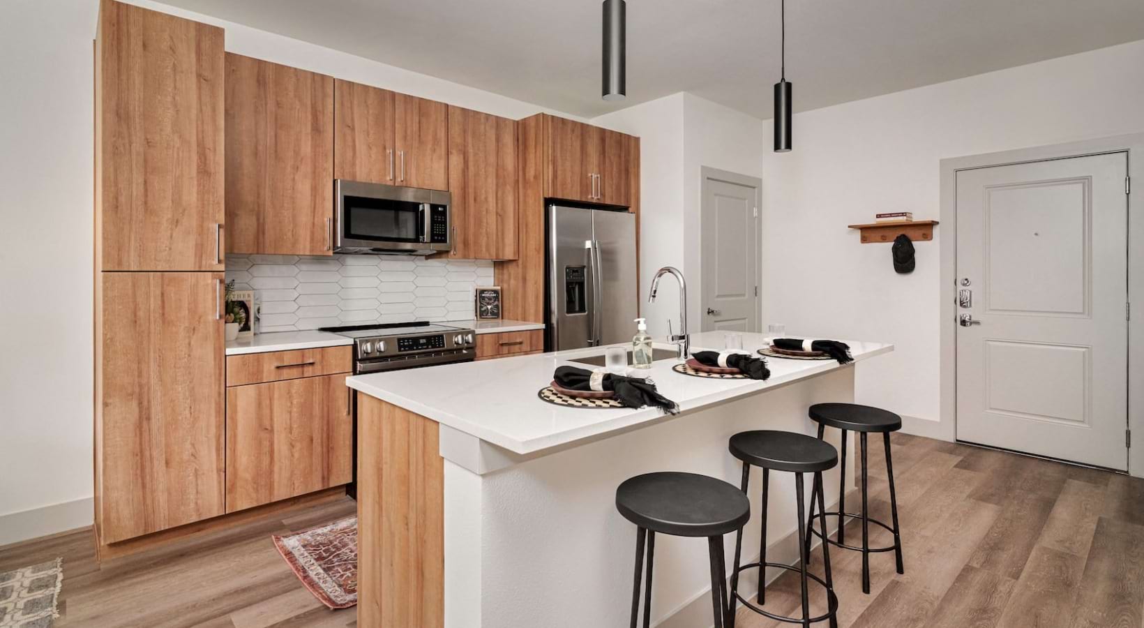 kitchen with island with white countertops and ample cabinets 