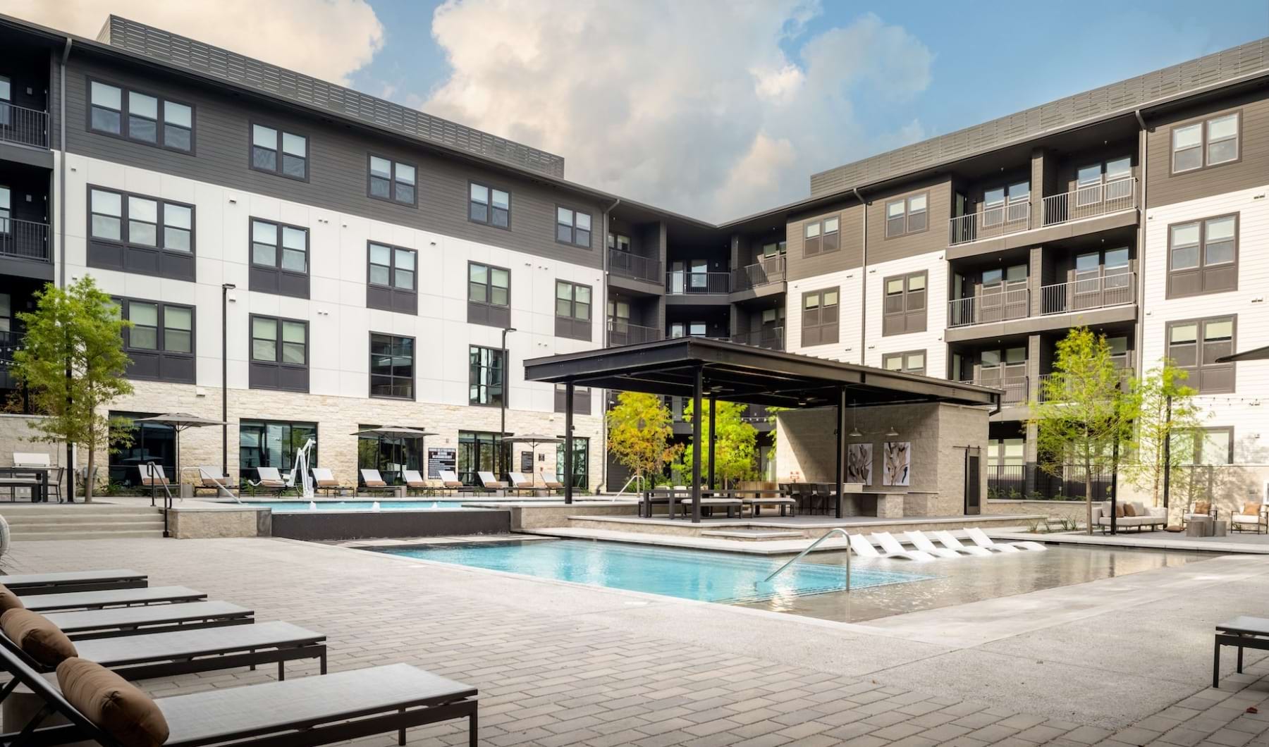 pool area with ample seating and entertainment areas