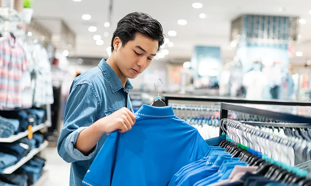 man shopping for shirts