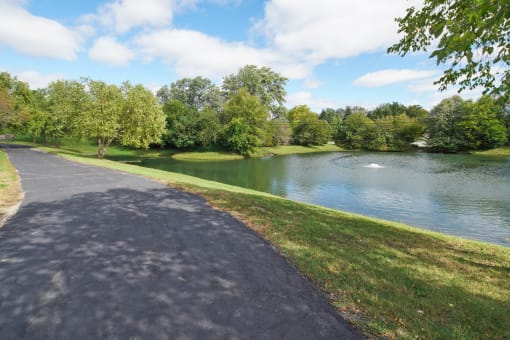 Glendale Heights Apartments for Rent - The Mark - walking trail path next to a lake pond in a park