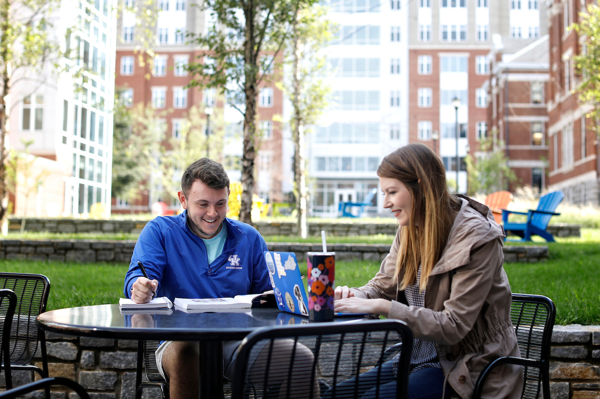Students eating at table outside of Boyd and Holmes Halls