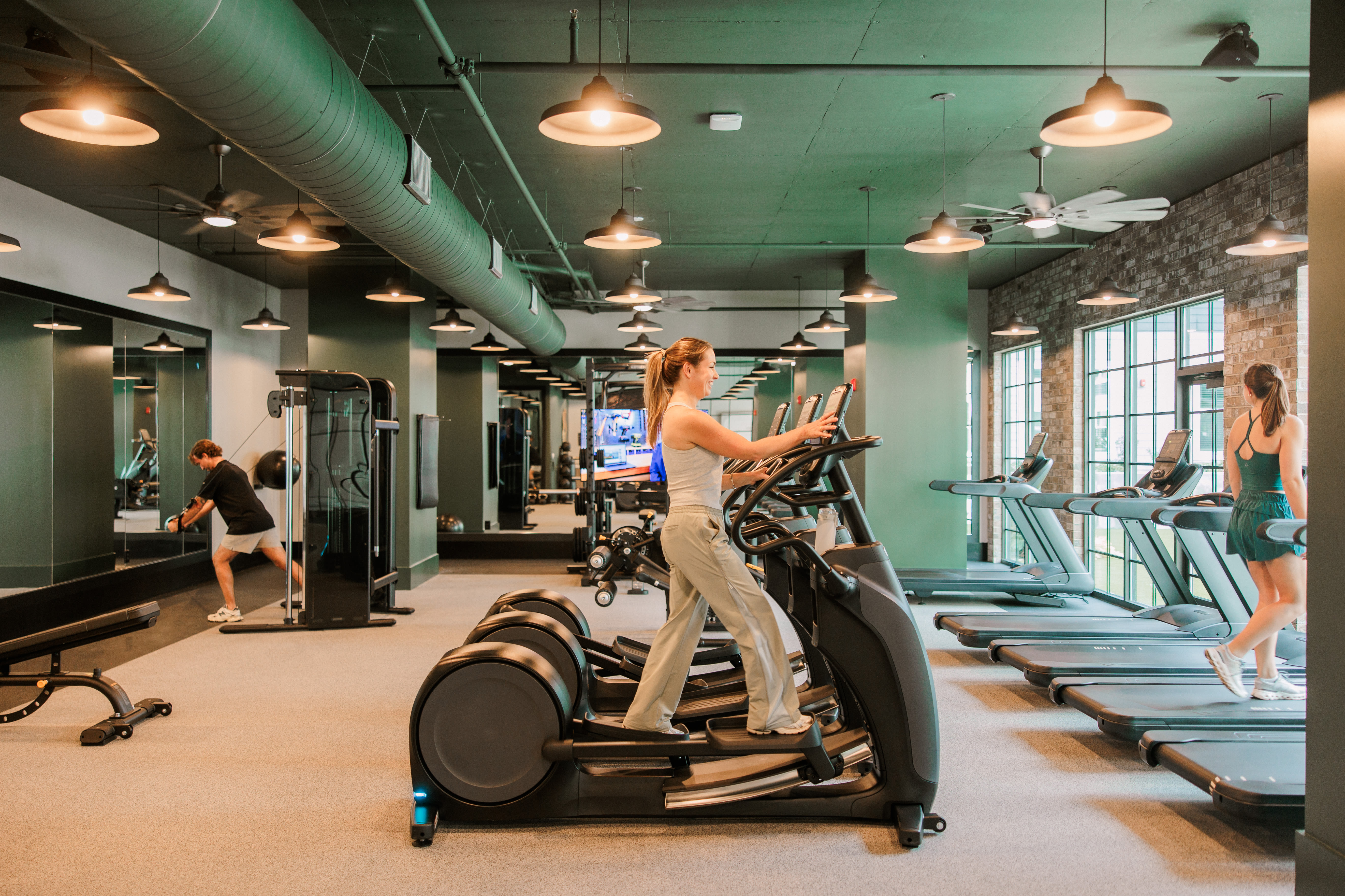 Fitness center with cardio machines at Oldham & Worth in Raleigh, NC