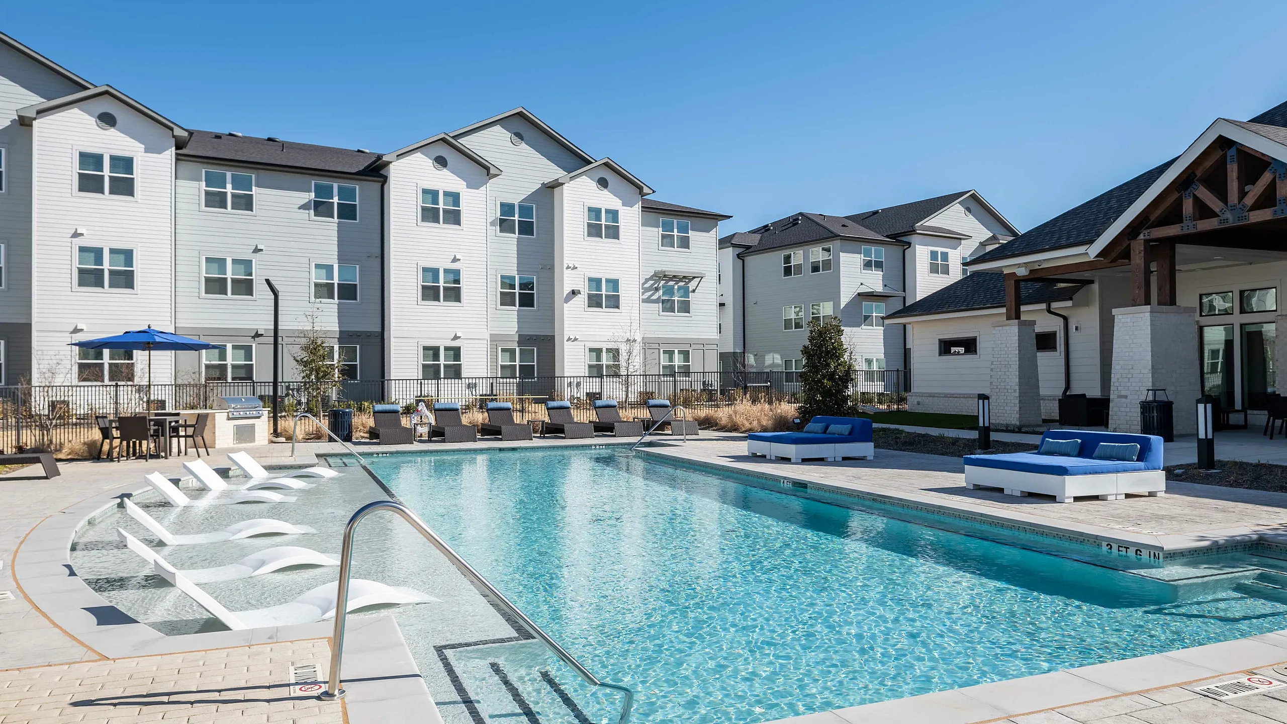 resort style pool and lounge seating