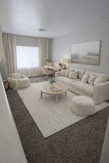 A living room with a white couch, a coffee table, and a painting on the wall.