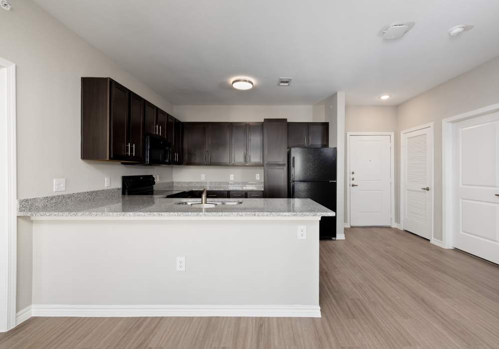 Kitchen with an island at Henderson on Reinli in Austin, Texas