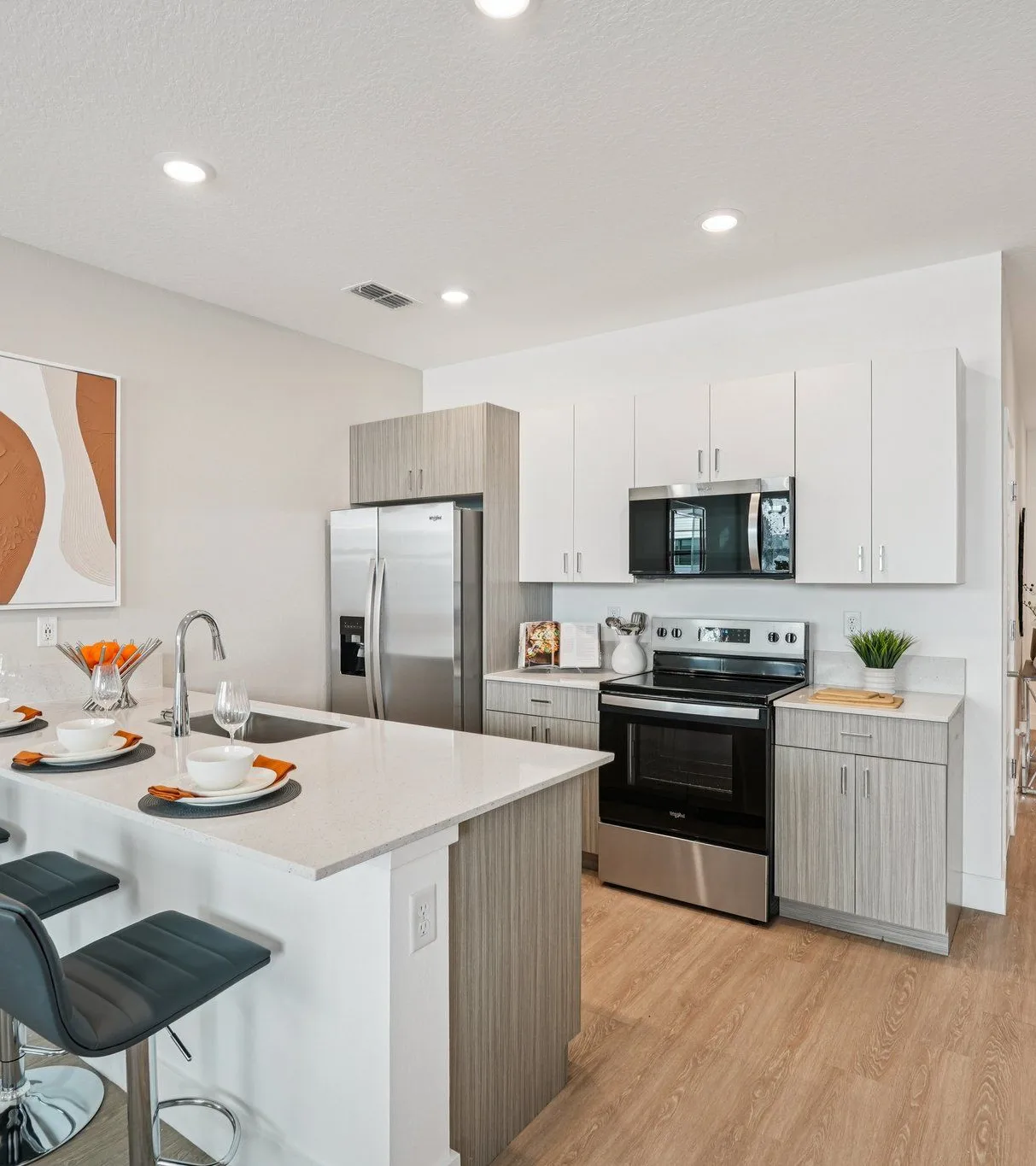 Modern, stylish kitchen and living area with natural light.
