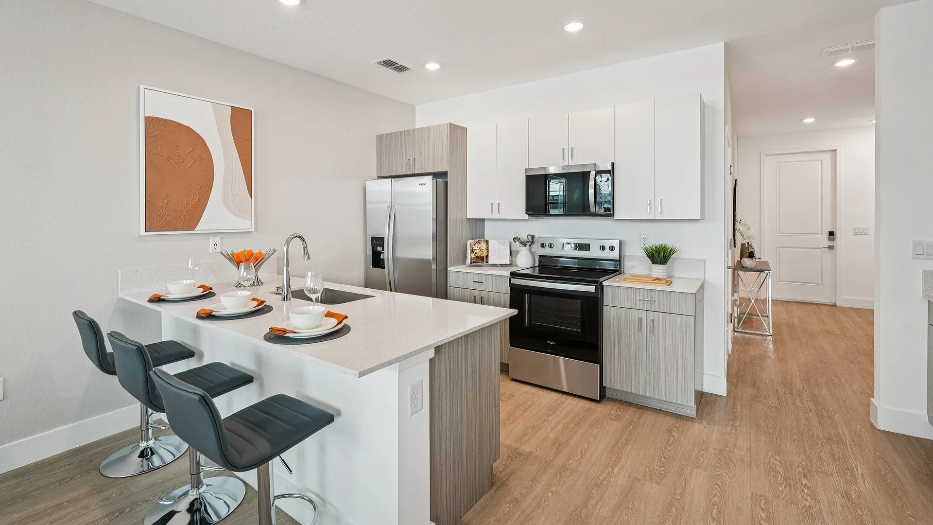 Modern, stylish kitchen and living area with natural light.