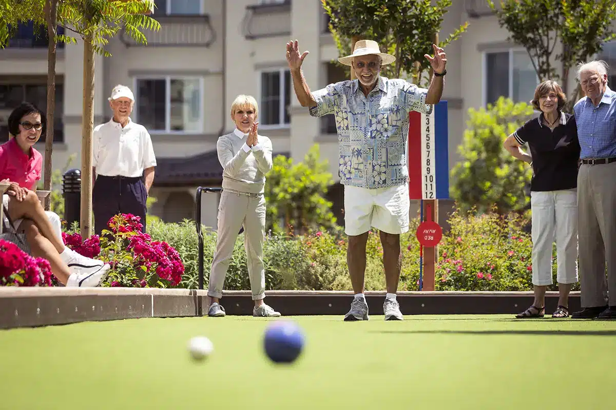 Two residents playing bocce ball at La Costa Glen.