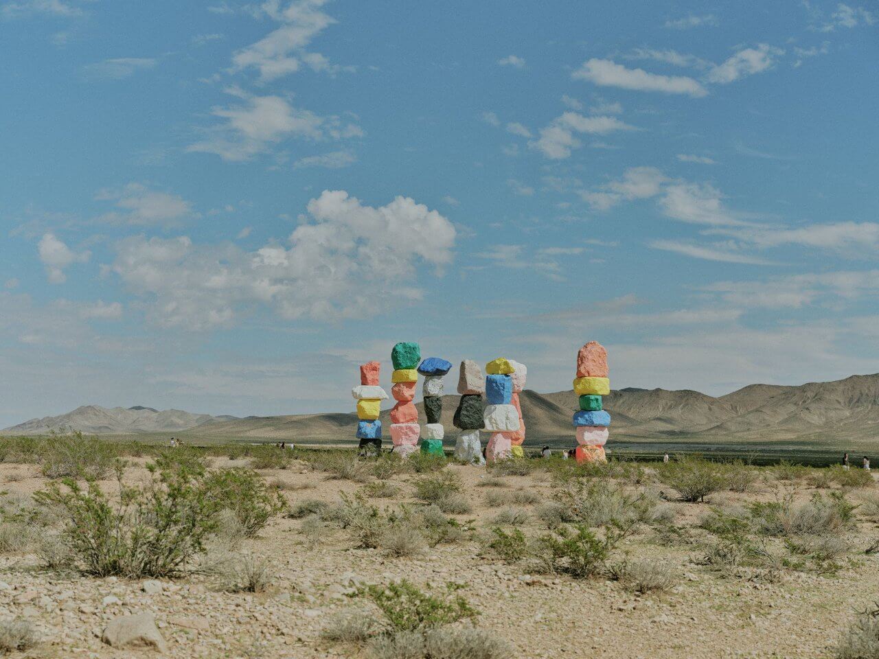 Colorful rock sculptures at Seven Magic Mountains in the Nevada desert near Miraluna, luxury apartment rentals.