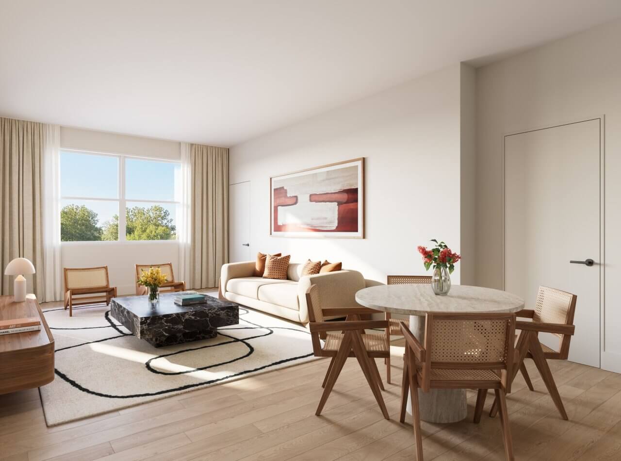 Bright living room at Miraluna luxury apartment with modern furnishings, a dining table, and a large window in Las Vegas.