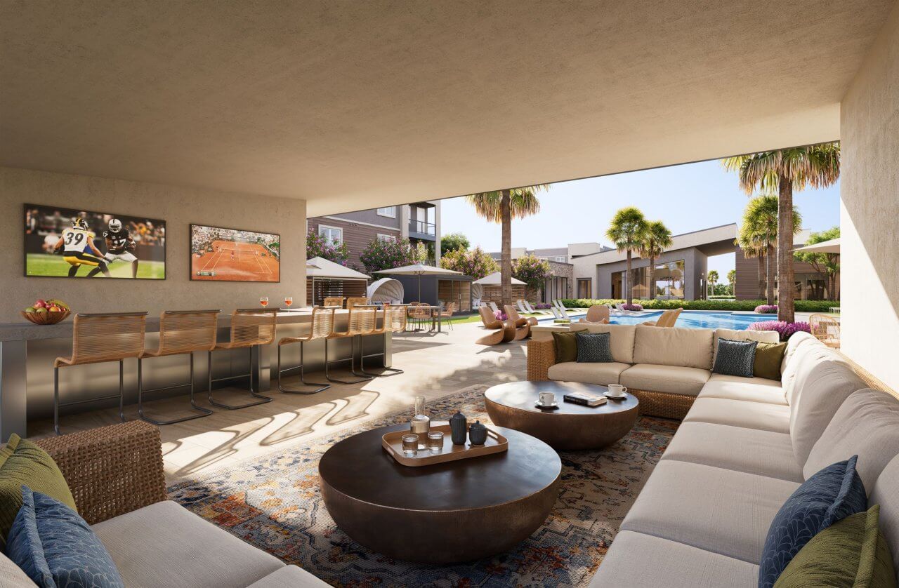 Outdoor pool lounge area with comfortable seating, TVs for entertainment at Miraluna, luxury apartment in Las Vegas.