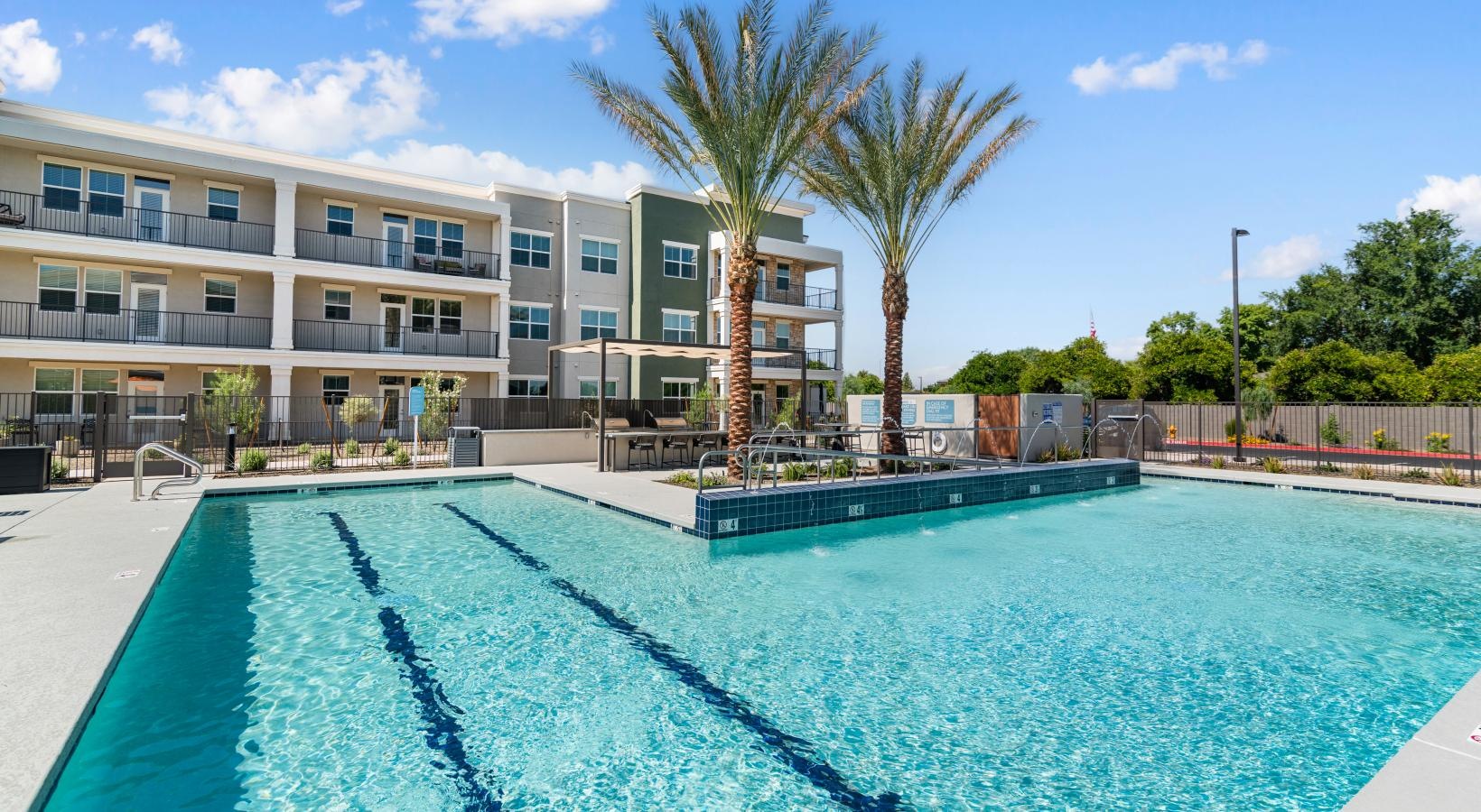 a swimming pool in front of a building