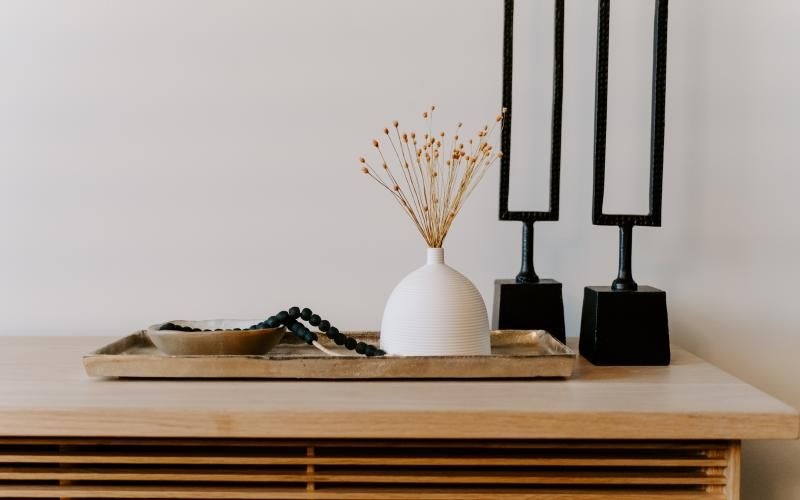 a vase with flowers on a table