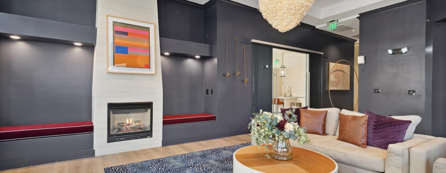 a living room with a large rug and a large chandelier