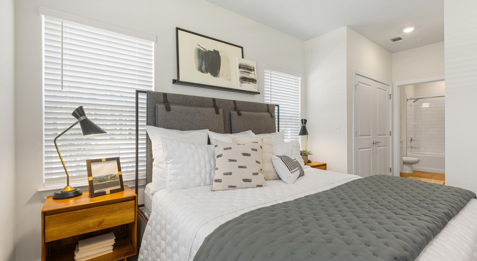 a bedroom with a bed and a table