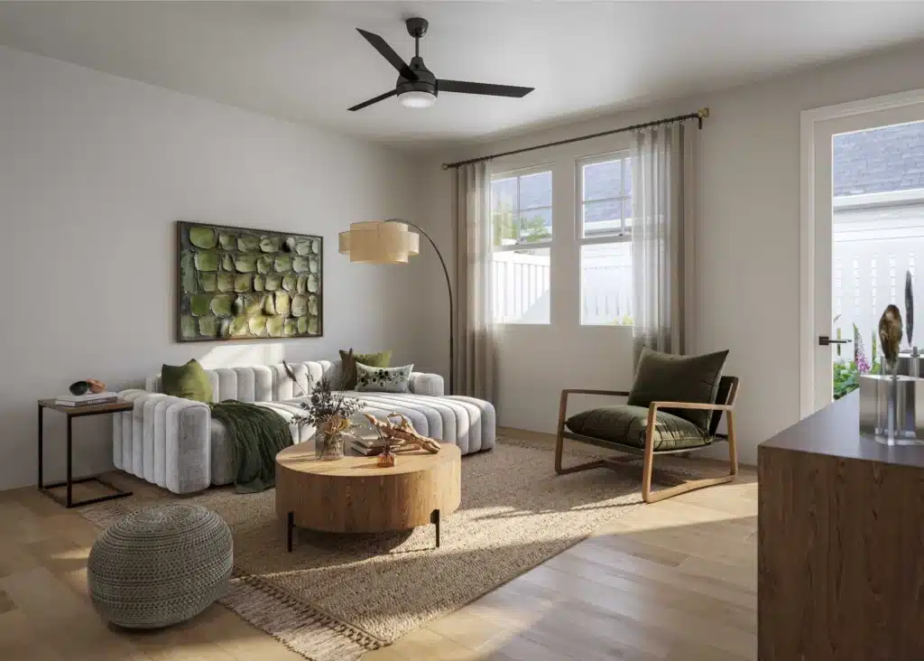 A modern living room with a striped sofa, green armchair, round wooden coffee table, woven rug, floor lamp, and wall art; sunlight streams through two windows and a glass door.