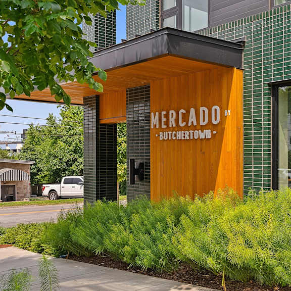 A Mercado Butchertown sign is displayed on a building.