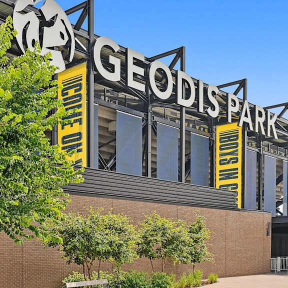 A building with a sign that says Geodis Park.