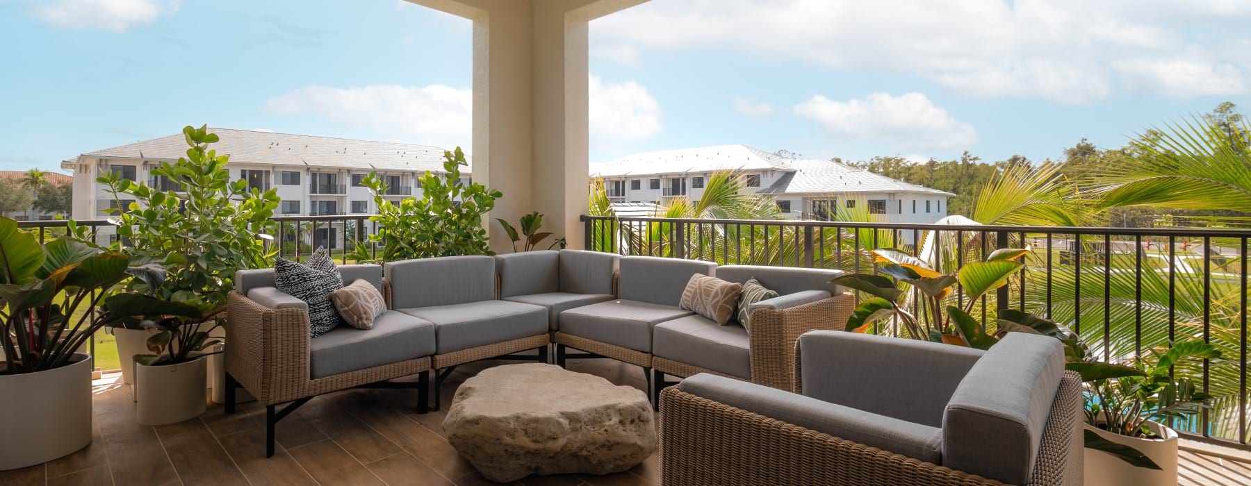 outdoor patio surrounded by green plants