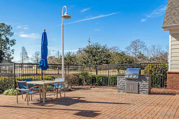 Outdoor Area with BBQ Grills at Greenbrier Estates Apartments in Slidell, LA
