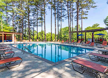 Pool with lounge chairs at Stratford Ridge, a pet-friendly community in Marietta, GA, near Smyrna.