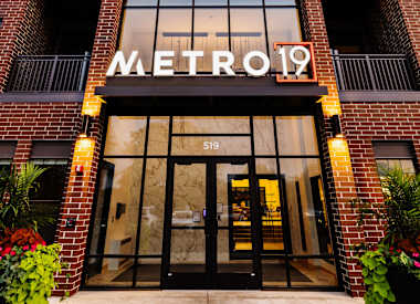 The entrance to a building with the sign Metro 19.