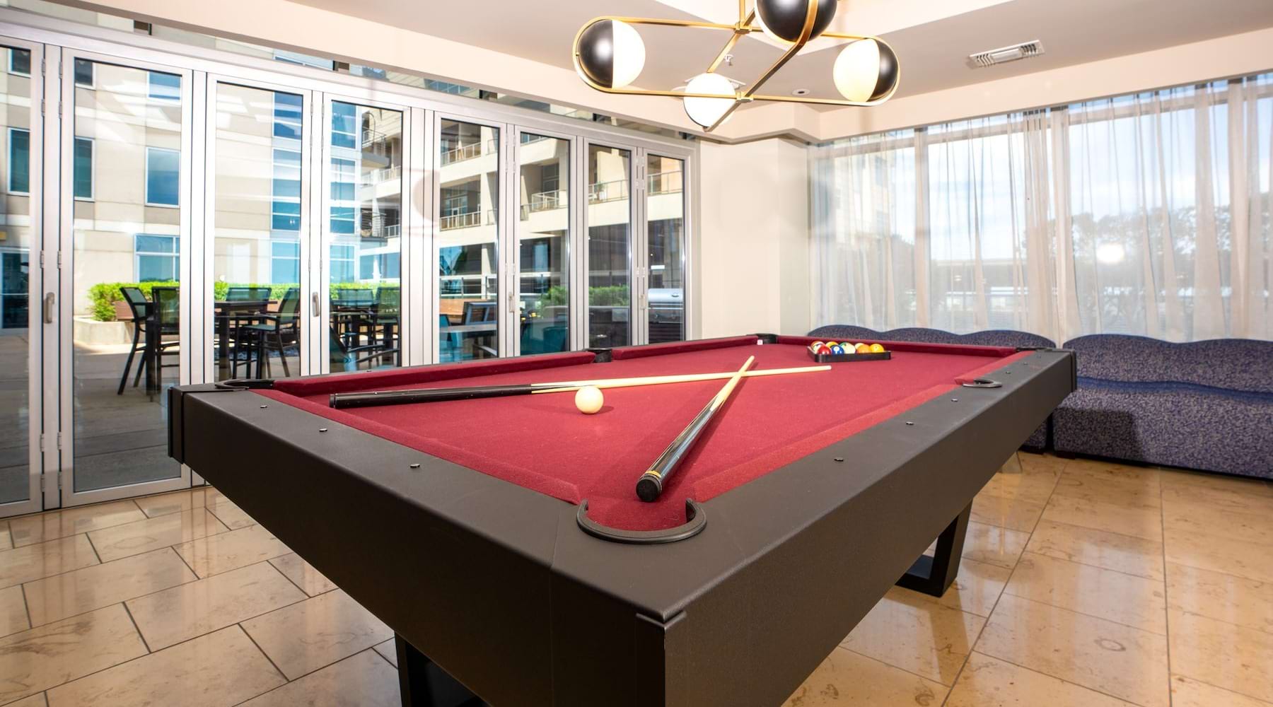 a room with a pool table and a couch