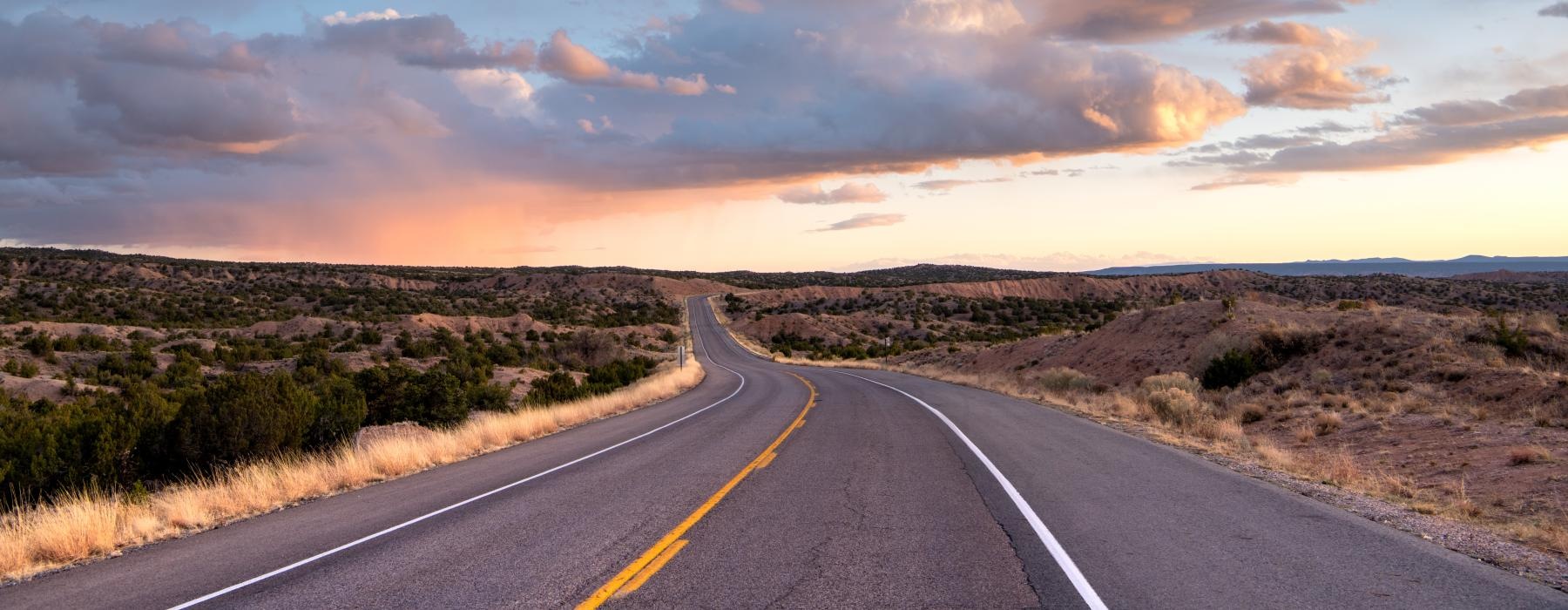A desert view of an open road for the Contact page for Roosevelt Point apartments 85004
