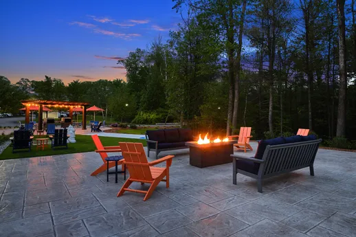 Outdoor Adirondack seating by fire pit.