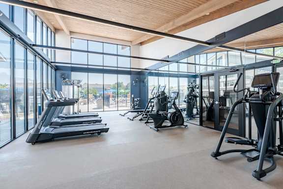 Well lit fitness center part of the new renovations at Addison at Princeton Meadows Apartments in Plainsboro, NJ