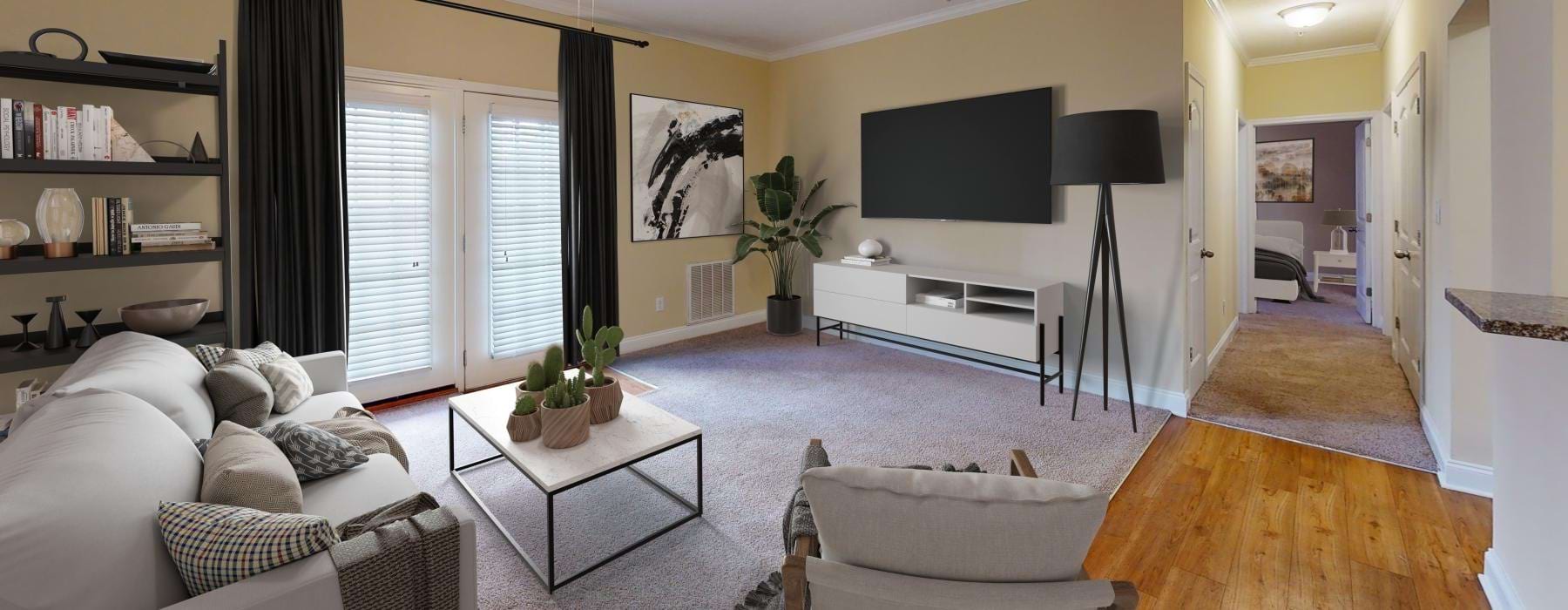 a living room with a tv and furniture