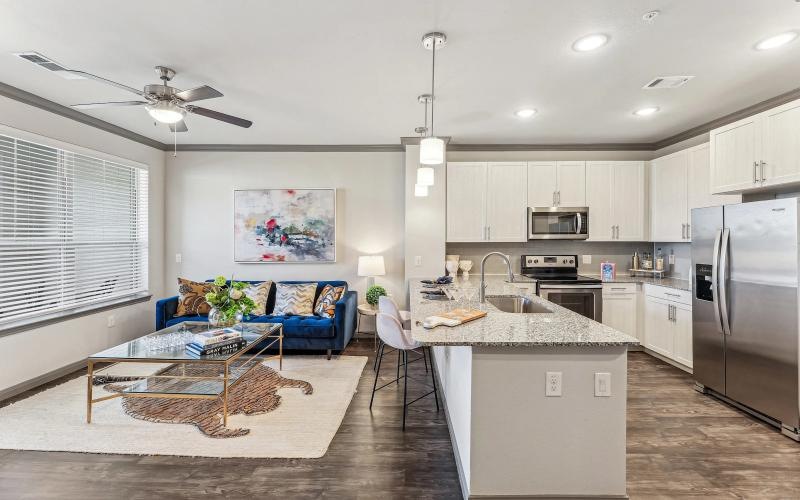 a kitchen with a couch and a table