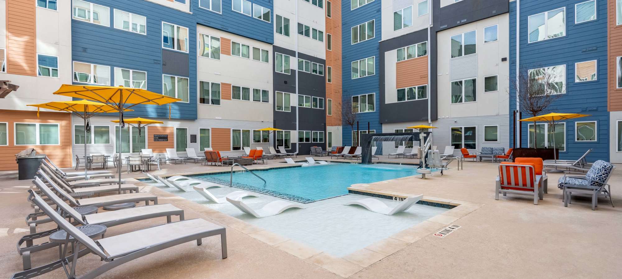Swimming pool and apartments at The Rail Apartments in Austin, Texas